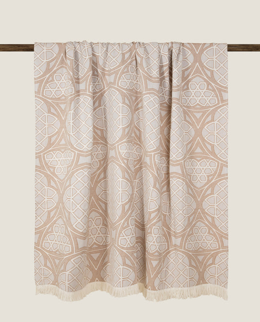 Plaid in 100% cotone dai colori tenui con frange